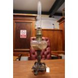 Art Nouveau Oil lamp with clear glass reservoir and narrow chimney
