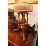 Victorian revolving piano stool with carved and turned supports