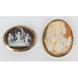 Large 19thC Oval Cameo depicting a man and woman in yellow metal mount with safety chain 6cm x 5cm