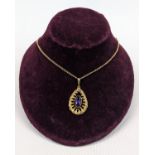 Ladies 20thC 9ct Oval gold mounted Faceted Amethyst on yellow metal chain. 1.4cm x 0.7cm. 11.5g