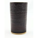 Dame Lucie Rie D.B.E (1902-1995) a stoneware cylindrical vase, the exterior bronze the interior