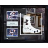 A framed and signed replica boxing boot signed by Anthony Joshua. Please note: this is a replica
