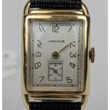Longines 14K Gold rectangular cased curved wristwatch with numeral face and second dial. Working