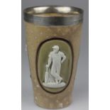 A Royal Doulton Lambeth Ware cricket beaker with a silver rim. The three scenes are of cricketers in