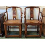 Pair of late 19th/ early 20th century Chinese Huanghuali continuous yoke back armchairs (scholars