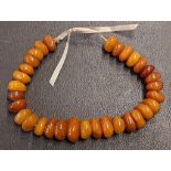 Large, beaded butterscotch Baltic amber necklace 107g total weight.