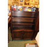 Oak open bookcase with cupboard to base