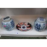 Pair of Blue and white lidded Chinese jars with character markings and an Imari pattern oval