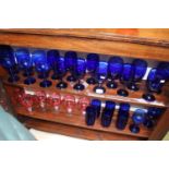 Collection of Bristol Blue drinking glasses and a a set of Panelled Cranberry wine glasses