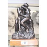 Auguste Rodin 1840 - 1917; The Kiss Bronzed sculpture on wooden plinth