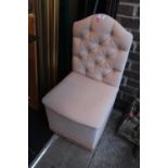 Upholstered button back chair with integral storage