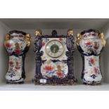 Large Phoenix ware Mantel clock with vase garnitures and floral decoration