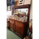 Edwardian Walnut mirror backed dresser with brass drop handles and panel doors