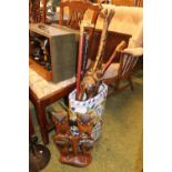 Large Oval pottery umbrella stand and assorted sticks and figures