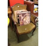 Upholstered wooden framed chair with brass button decoration