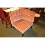 Victorian upholstered button back chair on turned legs and brass casters