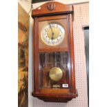 Mahogany cased wall clock with numeral dial