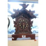 Large Black Forest carved bracket clock with roman numeral dial