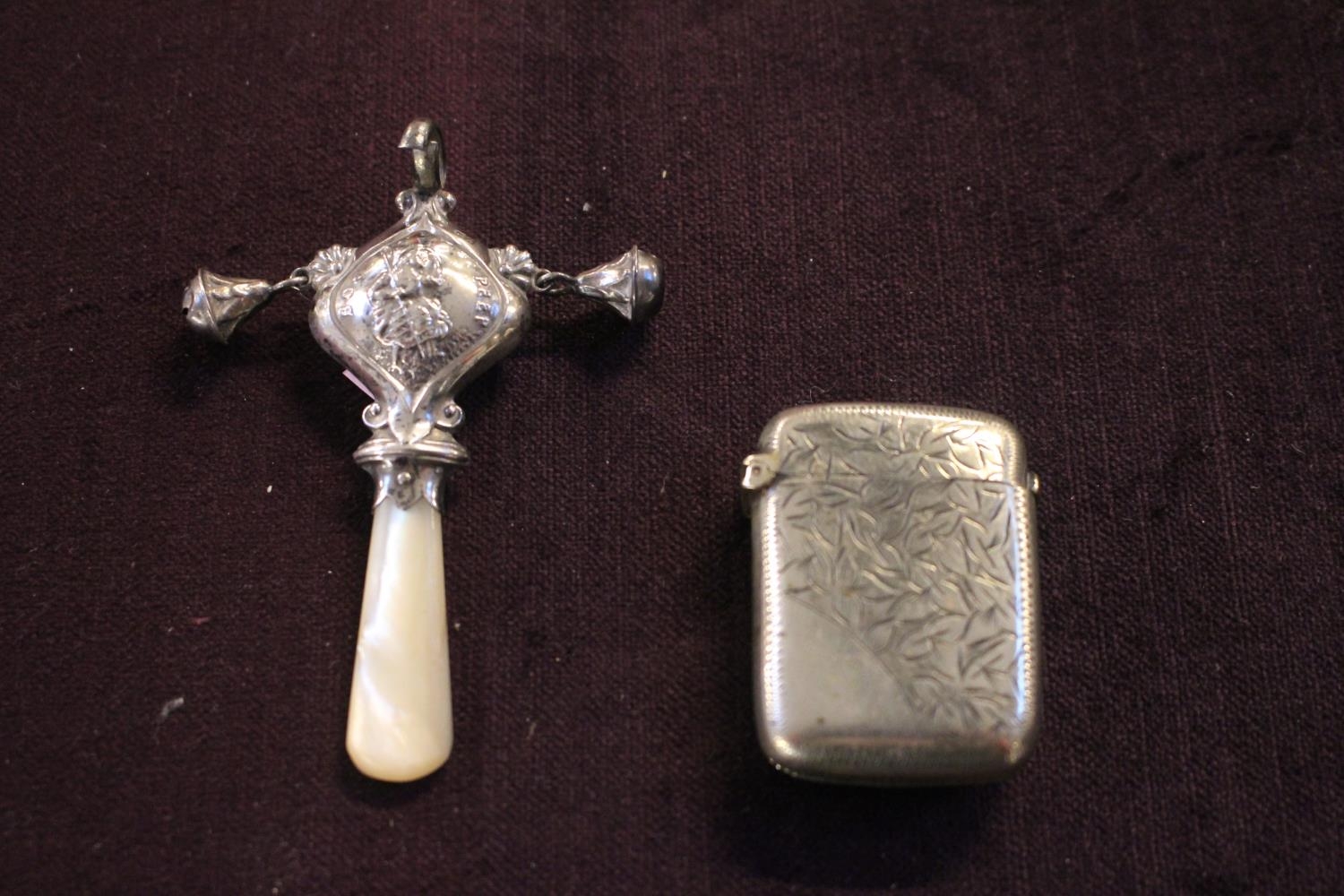 Silver Babies Mother of Pearl rattle and a Silver plated Match Vesta
