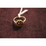 Ladies 9cct Gold Daisy design Garnet set ring Size K. 2.2g total weight