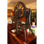 Vintage wooden spinning wheel and matching stool