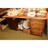 Leather topped pedestal desk with turned handles and cupboards to side