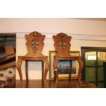Pair of Oak Carved back hall chairs with acanthus carved legs