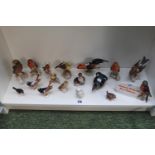 Large collection of Goebel and other ceramic bird figures and a Cabinet sign
