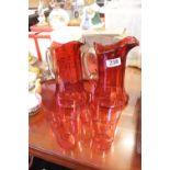 Pair of Cranberry glass Water Jugs and a set of 4 Cranberry Glasses