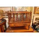 19thC Walnut Canterbury with turned spindles over caster feet