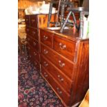 Modern Pine Chest of 2 over 3 drawers with brass drop handles and a Modern Pine Chest of 2 over 4