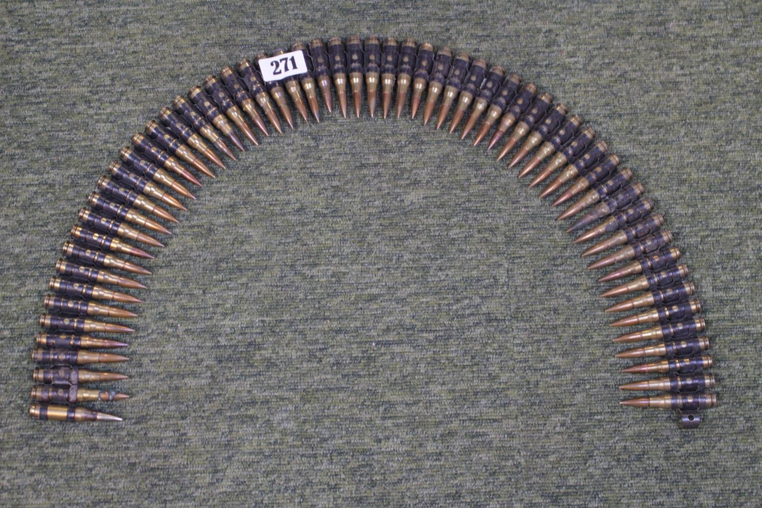 Belt of 60 machine gun bullets inert
