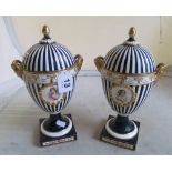 A pair of Continental lidded vases blue ground with cartouche of ladies (both lids a/f)
