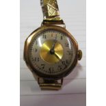 A ladies 9ct gold watch on flexible strap