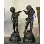 A pair of spelter cherub figures on marble bases one playing the saxophone the other a tambourine
