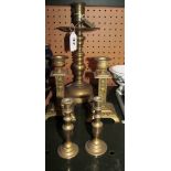 A brass bell metal candlestick converted for electricity, pair of brass candlesticks with embossed