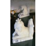 A pair of alabaster lion and unicorn bookends