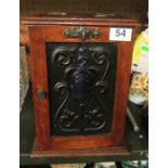An oak smokers cabinet with Art Nouveau style panel to door