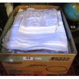 A box of large damask and linen cloths