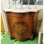 A serpentine front marble top side cabinet