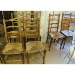 Six oak ladder back chairs with rush seats
