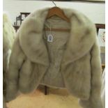 Two white fur jackets (slightly dirty around neck and some wear)