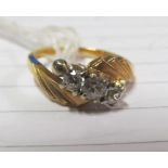 A yellow metal three stone ring, marked 10k