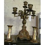 A five branch metal candelabra and a pair of small brass candlesticks tassel design