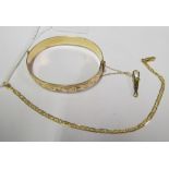 A yellow metal bracelet marked 750 4.6g and a metal core bangle bracelet