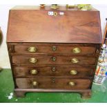 A George III mahogany bureau four drawers on bracket feet (water damage)