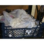 A crate of crochet, embroidery and cotton cloths, napkins and other items