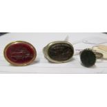 A ring inset carved intaglio stone of a classical lady, a similar red stone fob and another with