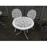 A garden table and two chairs