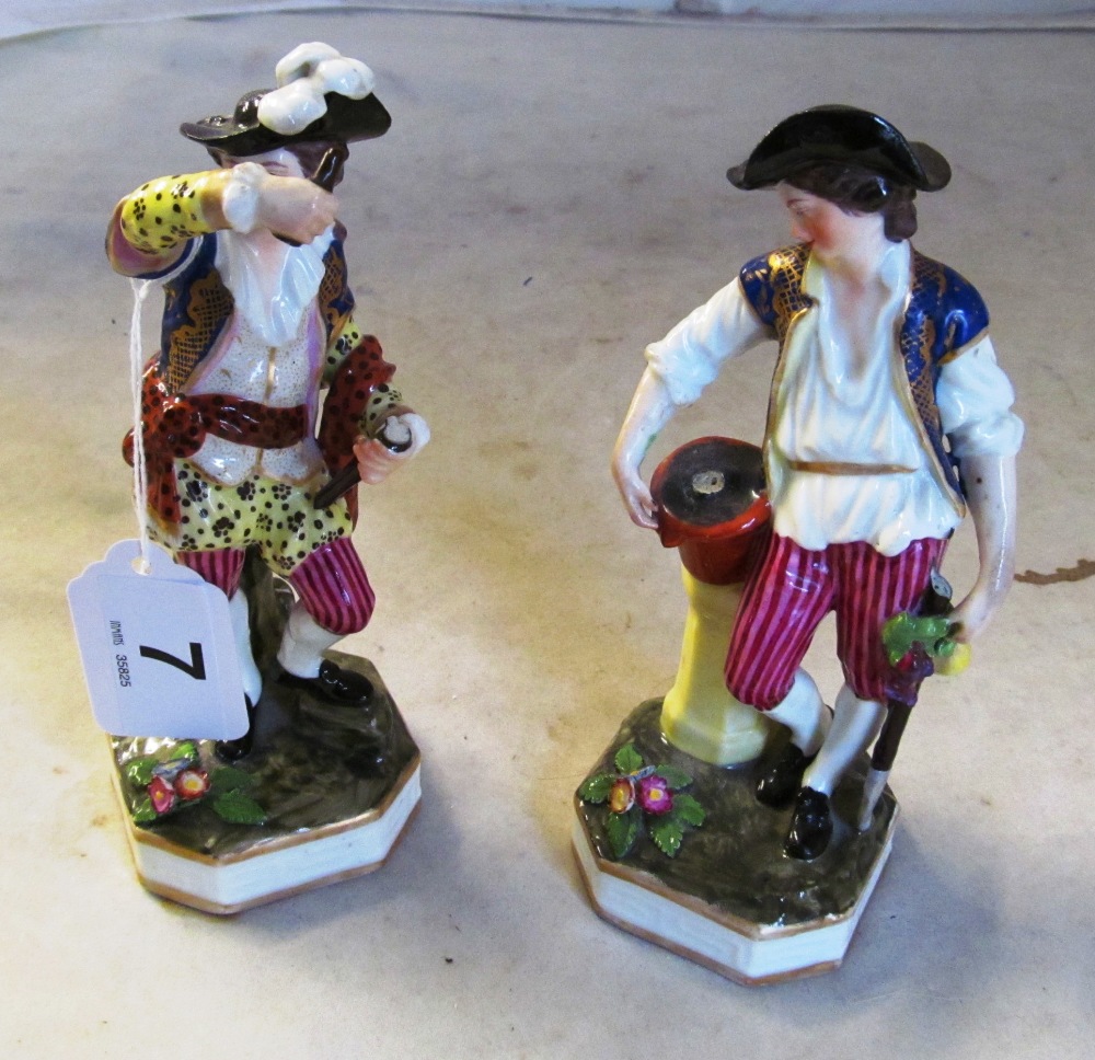 A pair of porcelain figures with Derby mark (both a/f)